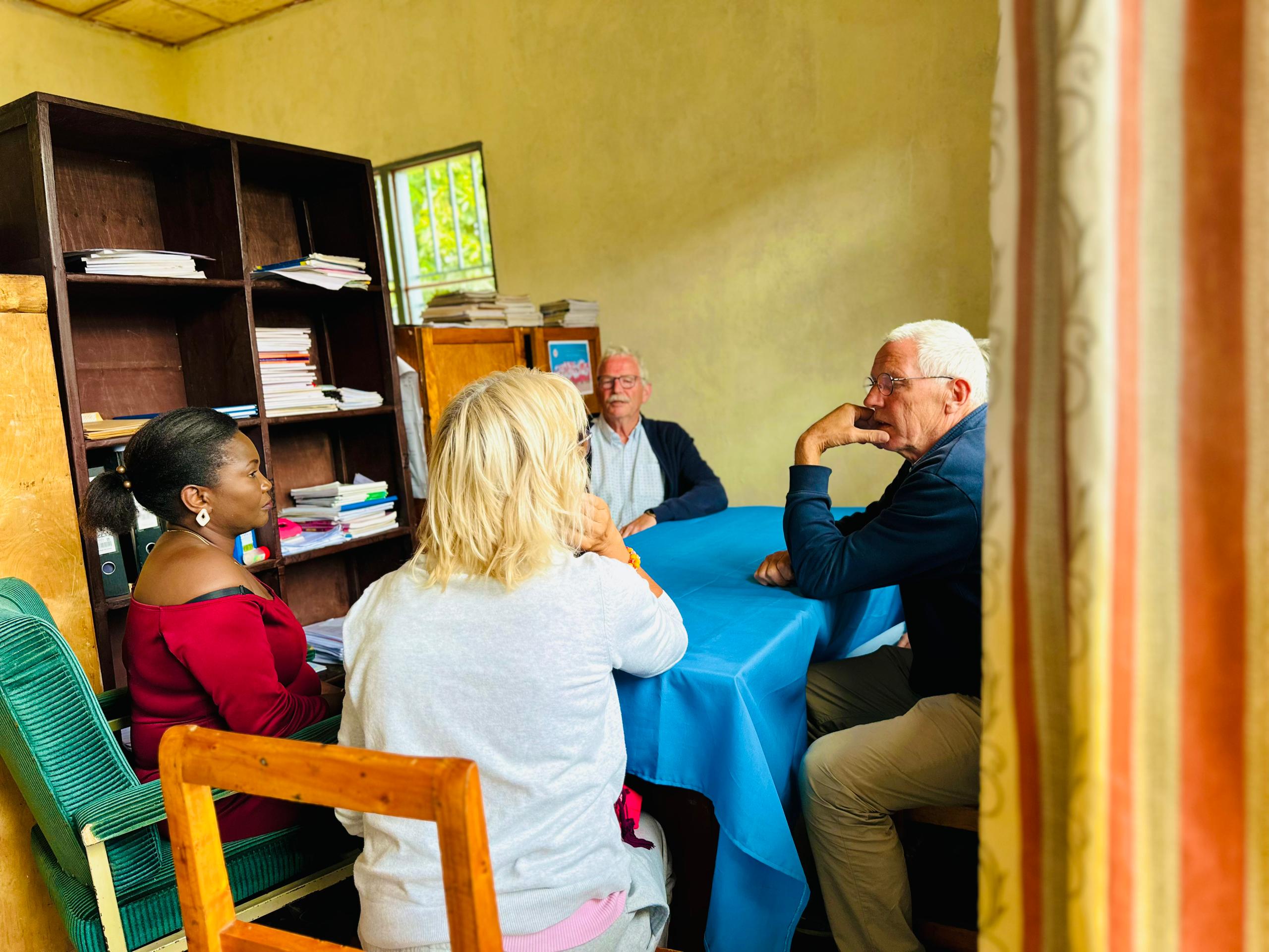 vistor with school staff